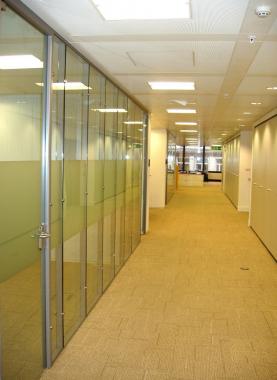 Flush glazed partiton system with glass doors
